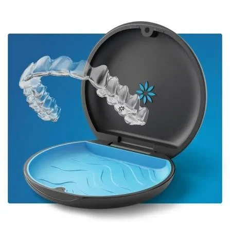 Clear orthodontic aligners stored in a protective case